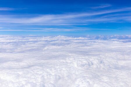 Blue sky background with tiny clouds for graphic design or website template.
