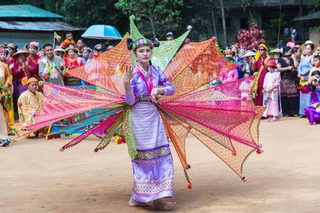 Thoet Thai, Chiang Rai - THAILAND, December 12, 2018 : Group of Shan or Tai Yai (ethnic group living in parts of Myanmar and Thailand) in tribal dress do native dancing in Shan New Year celebrations.のeditorial素材