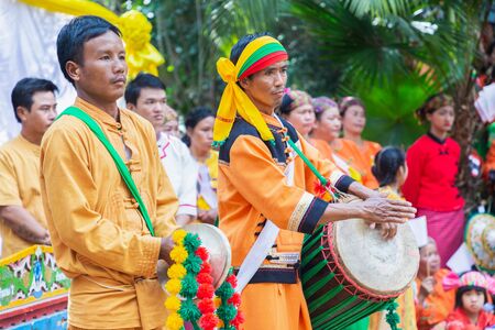 Thoet Thai, Chiang Rai - THAILAND, December 12, 2018 : Group of Shan or Tai Yai (ethnic group living in parts of Myanmar and Thailand) in tribal dress do native dancing in Shan New Year celebrations.のeditorial素材