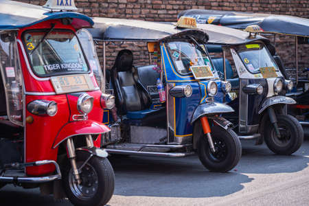 Chiang Mai - THAILAND, February 8, 2020 : Tuk Tuk (auto rickshaw) is a common form of urban transport in Chiang Mai, Thailand. Tuk Tuk (auto rickshaw) taxi parked on the street and waiting for tourists.のeditorial素材