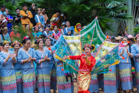 Thoet Thai, Chiang Rai - THAILAND, December 12, 2018 : Group of Shan or Tai Yai (ethnic group living in parts of Myanmar and Thailand) in tribal dress do native dancing in Shan New Year celebrations.のeditorial素材