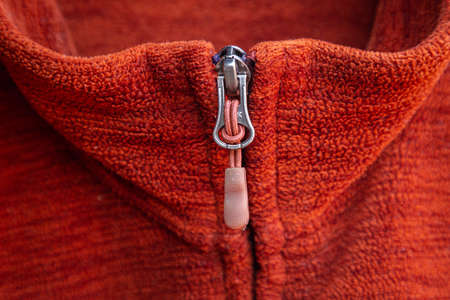 Zip zipper close up macro on red clothes backgroundの写真素材