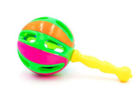 Colorful baby rattle toy with yellow handle isolated on the white background