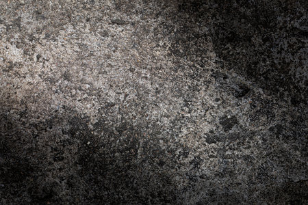 Gray textured cement wall background with fine concrete chips. Construction backgrounds.の写真素材