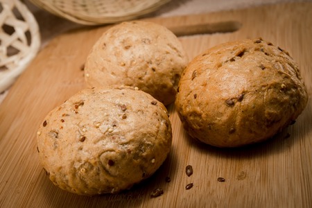 bread with sesame grinding on a chopping board