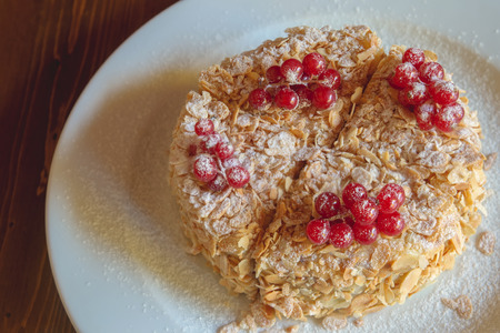 Cake with berries red currant on a white trayの写真素材