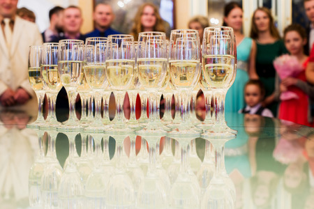 set standing on a table with glasses of champagneの写真素材
