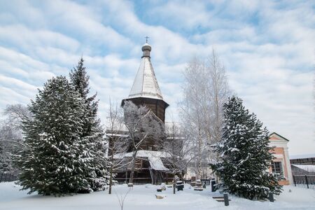 Wooden church and treeの写真素材