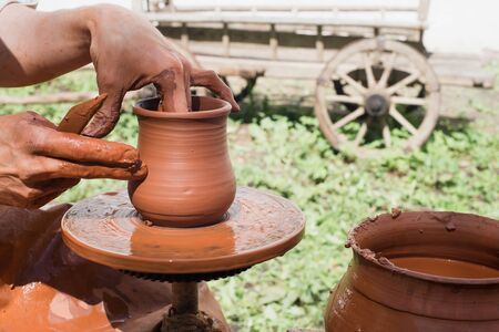 manufacturing pitcher hands on a rotating frameの写真素材