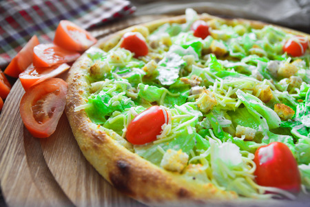 Pizza on the cutting boardの写真素材