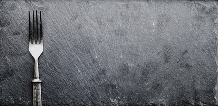 Fork on a black slateの写真素材