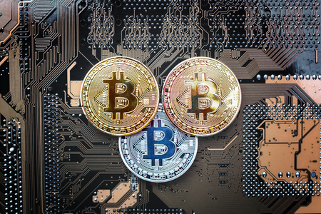 Coin bitcoin on a computer boardの写真素材