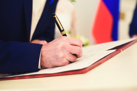 hand with pen writesの写真素材