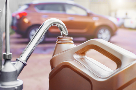 canister and part of the fluid pump on the background of the car with a shallow depth of fieldの写真素材