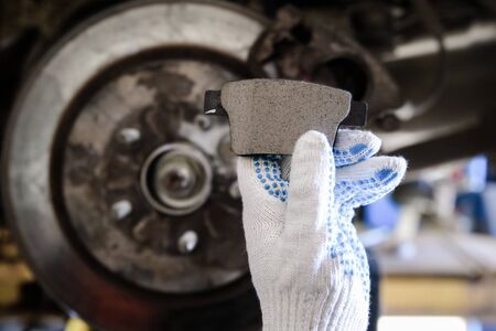 gloved hand hold brake pad with shallow depth of fieldの写真素材