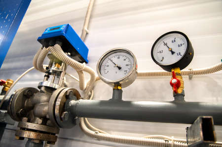 new pressure gauges showing the pressure in the heating system at a shallow depth of field