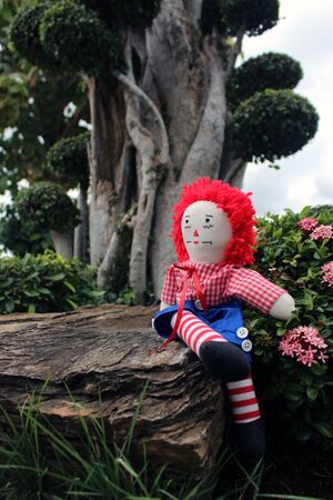 Old Time Rag Doll sitting outside, Ghost mystic doll. Scary horror dollの写真素材