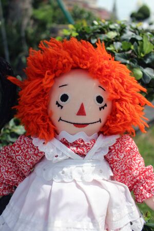 Old Time Rag Doll sitting outside, Ghost mystic doll. Scary horror dollの写真素材