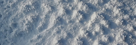 Snow background. Snow texture. Snowdrift. Snowflakes on the snow.の素材