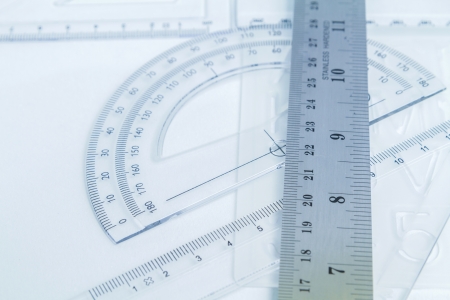 transparent plastic and aluminium rulers isolated on whiteの写真素材