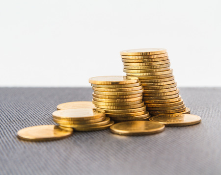 coins stack on book with white background