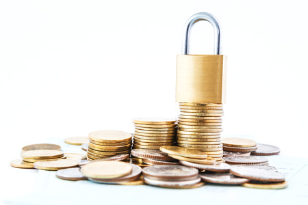 coins stack lock concept and white backgroundの写真素材