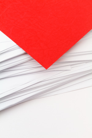 red cardboard and white paper space for textの写真素材