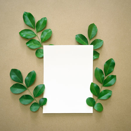 white flat paper rectangle shape at center and fresh green leaves foliage isolated with empty space...