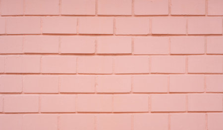 coral orange pastel clean empty brickwork wall block pattern panel paint exterior design with copy space abstract background.for house construction material backdrop,vintage or retro wallpaper design.の写真素材