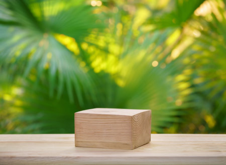 empty top table pine wood podium texture in tropical outdoor nature garden forest green plant golden sunlight jungle background with space.organic healthy natural product present promotion display.の写真素材