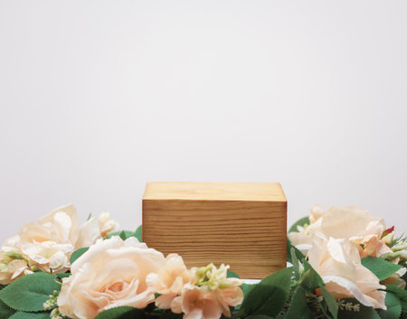 empty wooden podium beige rose bouquet flowers decoration on white background with space.beauty cosmetic and romantic valentines or mother,birthday woman love gift product present scene stand display.の写真素材
