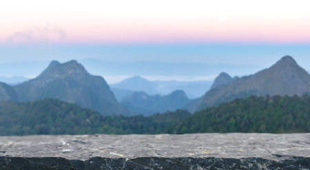 empty rock stone tabletop with misty mountain relax scene nature landscape at sunrise blur background.tourism travel vacation time season,climbing sport outdoor product presentation pedestal podium.の写真素材