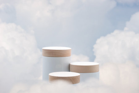 Surreal podium outdoor on blue sky soft white clouds with space.Beauty cosmetic product placement pedestal present stand minimal display,summer paradise dreamy concept.の写真素材