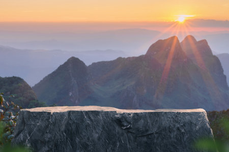Surreal stone table top podium outdoors misty mountain golden light sunset nature background.cosmetic product placement pedestal present minimal display,paradise dreamy concept.の写真素材