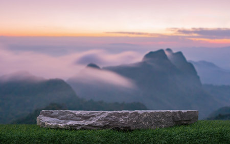 Surreal stone table top podium outdoors blurred misty mountain at sunset nature background.cosmetic product placement pedestal present minimal display,paradise dreamy concept.の写真素材