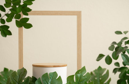 Minimal wood white podium with blurred green leaf plant on beige background.Beauty cosmetic natural mild product modern display,nature eco friendly concept.の写真素材