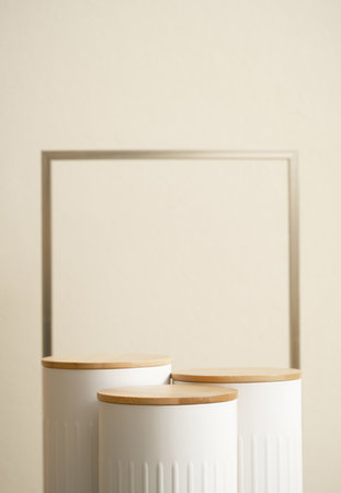 Minimal wood white podium with blurred golden frame on gold beige background.Beauty cosmetic new product modern display,luxury celebrate concept.の写真素材