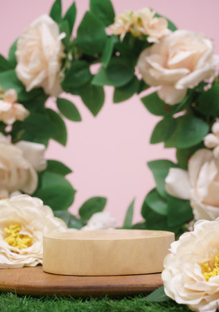 wood podium beige rose flowers on pink pastel background with space.beauty cosmetic skin care advertising stage,luxury romantic love valentines or mother gift, product pedestal platform stand display.の写真素材