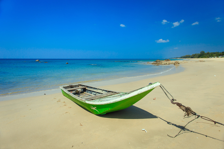 traditional long tail boat stand on the beach in Thailandの写真素材
