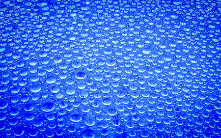 Water drop on glass background の写真素材