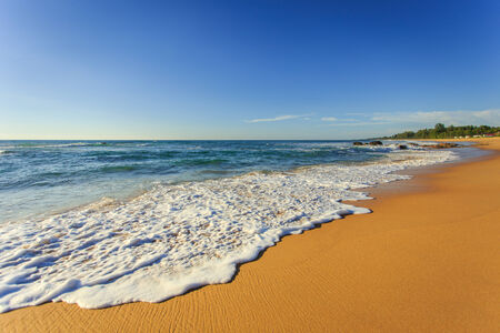 White bubble Wave on the beachの写真素材