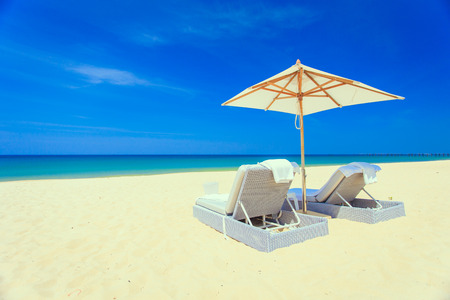 Sunbed and umbrella on the beachの写真素材