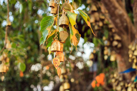 Bells outside the buddhist temple in Thailandの写真素材