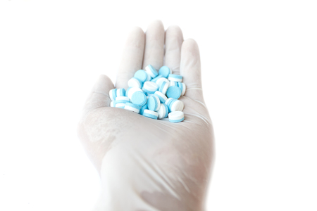 Hand holding medicine , isolated on white backgroundの写真素材