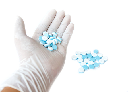 Hand holding medicine , isolated on white backgroundの写真素材