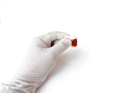 Hand holding cotton, isolated on white backgroundの写真素材