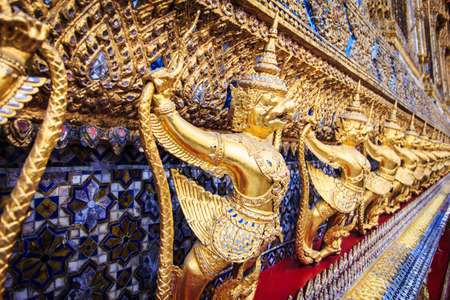 Golden garuda statues at Wat Phra Kaew in Grand Palace, Bangkok, Thailandのeditorial素材
