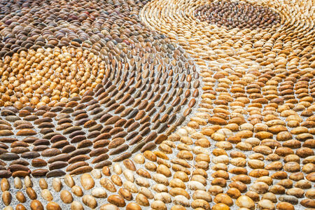 stone walkway background or texture with colorful pebblesの写真素材