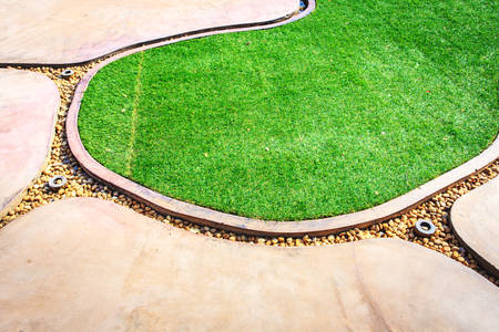 Walkway and green grass in the parkの写真素材