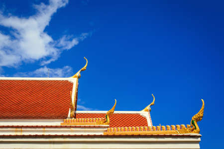 Roof gable in Thai temple with blue sky